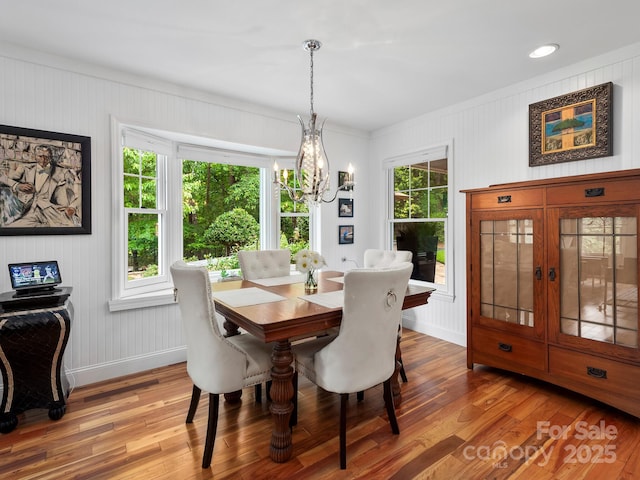 1165 Mountain Laurel Dr, Columbus, NC 28722 - dining space with a chandelier, wood finished floors, crown molding, and baseboards