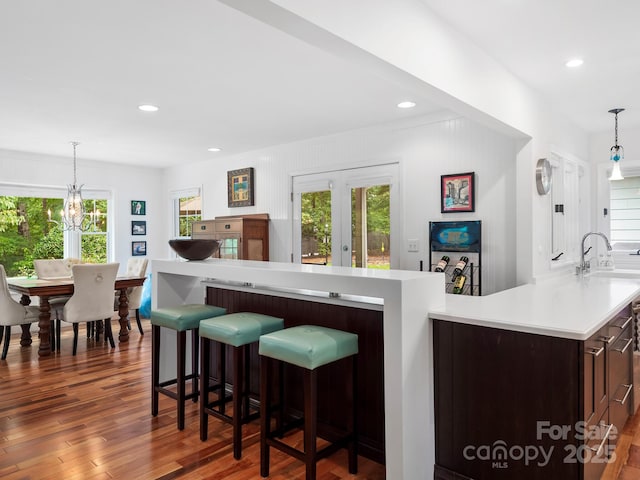1165 Mountain Laurel Dr, Columbus, NC 28722 - kitchen with light countertops, wood finished floors, recessed lighting, a sink, and pendant lighting
