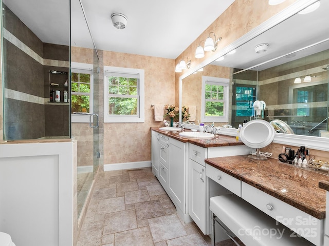 1165 Mountain Laurel Dr, Columbus, NC 28722 - full bath with healthy amount of natural light, stone finish flooring, a shower stall, and baseboards