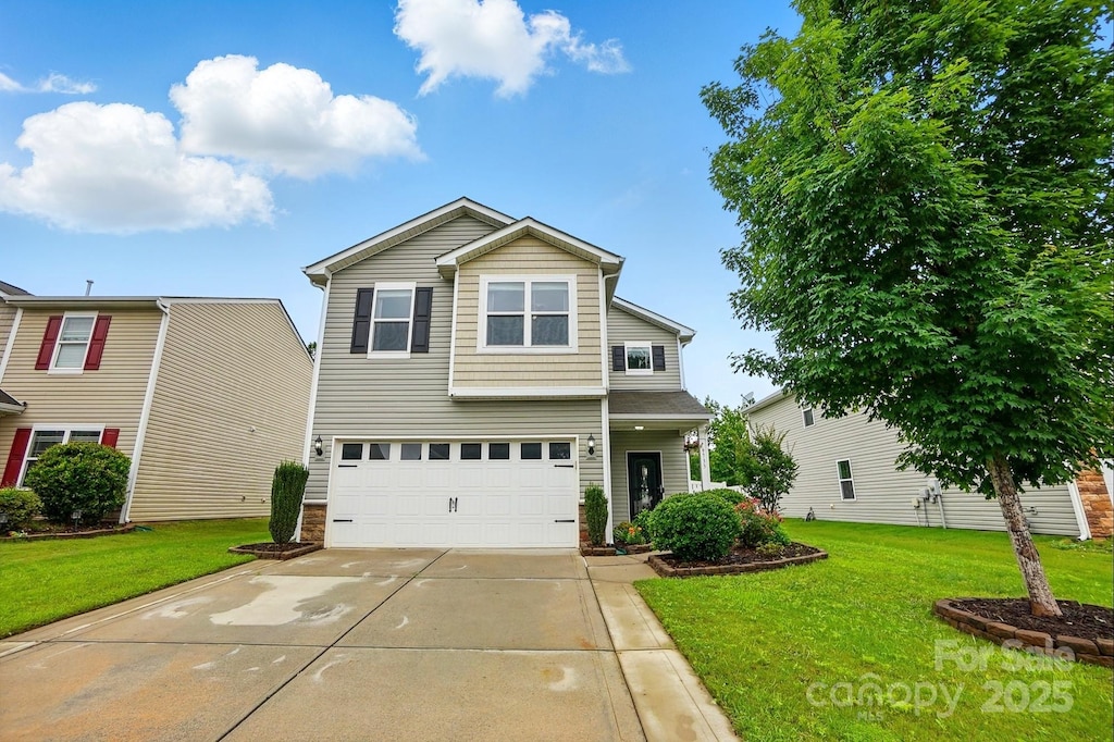9733 Paper Tree Rd, Charlotte, NC 28227 - traditional-style house featuring concrete driveway, a garage, and a front yard