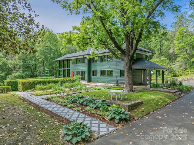 400 Kings Dr, Lake Lure, NC 28746 - view of front facade featuring a porch and a view of trees