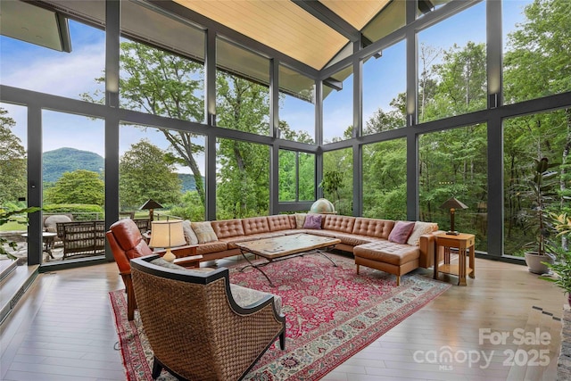 400 Kings Dr, Lake Lure, NC 28746 - sunroom featuring high vaulted ceiling, floor to ceiling windows, an outdoor hangout area, hardwood / wood-style flooring, and beam ceiling
