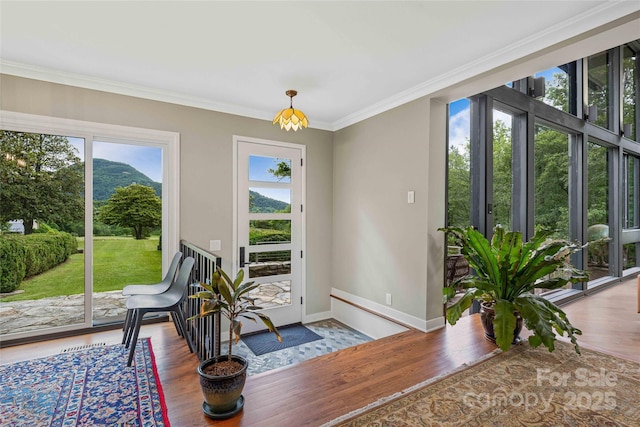 400 Kings Dr, Lake Lure, NC 28746 - dining space with ornamental molding, wood finished floors, and baseboards