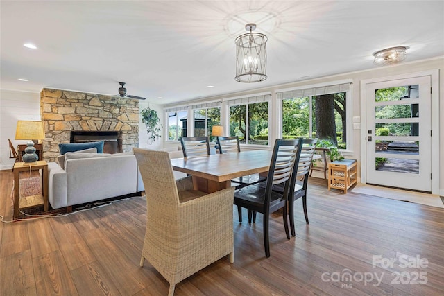 400 Kings Dr, Lake Lure, NC 28746 - dining area with wood finished floors, plenty of natural light, ceiling fan, a stone fireplace, and recessed lighting