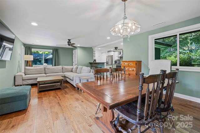 400 Kings Dr, Lake Lure, NC 28746 - dining area featuring ceiling fan, wood finished floors, a chandelier, recessed lighting, and baseboards