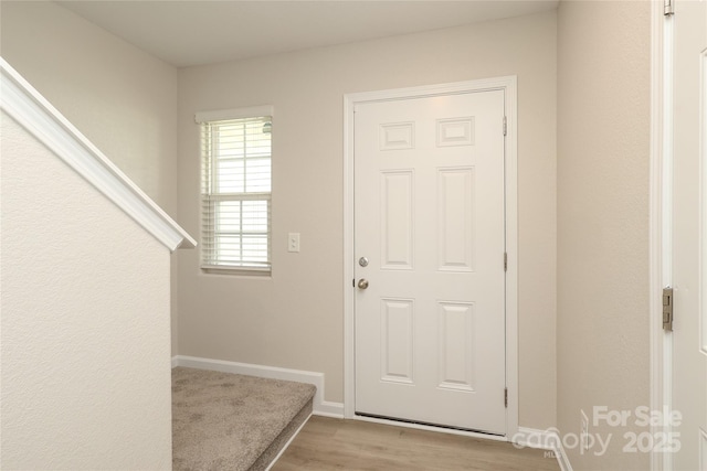 3349 Ellingford Rd, Charlotte, NC 28214 - foyer entrance with light wood-type flooring and baseboards