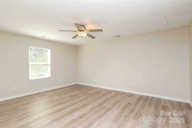 3349 Ellingford Rd, Charlotte, NC 28214 - spare room with ceiling fan, light wood-type flooring, baseboards, and a smoke detector