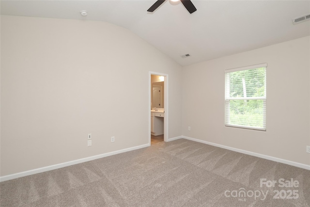 3349 Ellingford Rd, Charlotte, NC 28214 - unfurnished bedroom featuring lofted ceiling, carpet floors, baseboards, ensuite bath, and a ceiling fan