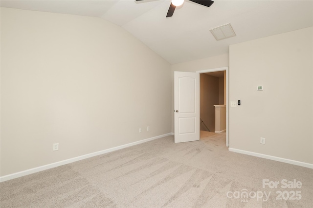 3349 Ellingford Rd, Charlotte, NC 28214 - unfurnished bedroom with vaulted ceiling, light carpet, baseboards, and a ceiling fan