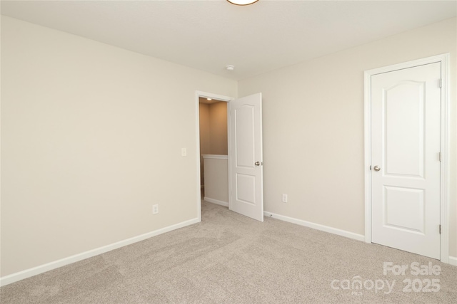 3349 Ellingford Rd, Charlotte, NC 28214 - unfurnished bedroom featuring light carpet and baseboards