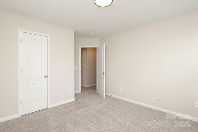 3349 Ellingford Rd, Charlotte, NC 28214 - unfurnished bedroom with light colored carpet and baseboards