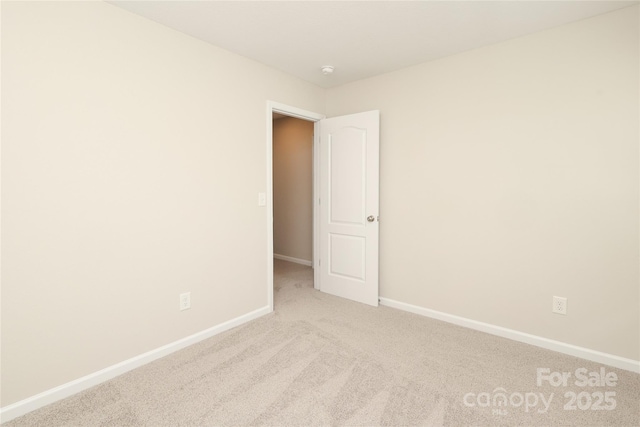 3349 Ellingford Rd, Charlotte, NC 28214 - carpeted empty room featuring baseboards and a smoke detector