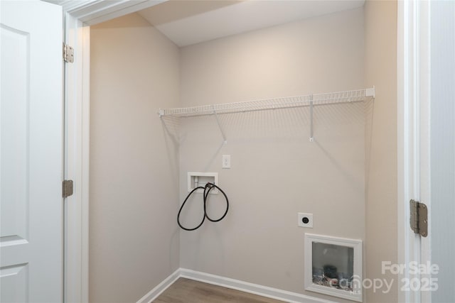 3349 Ellingford Rd, Charlotte, NC 28214 - laundry area with hookup for a washing machine, electric dryer hookup, wood finished floors, and baseboards