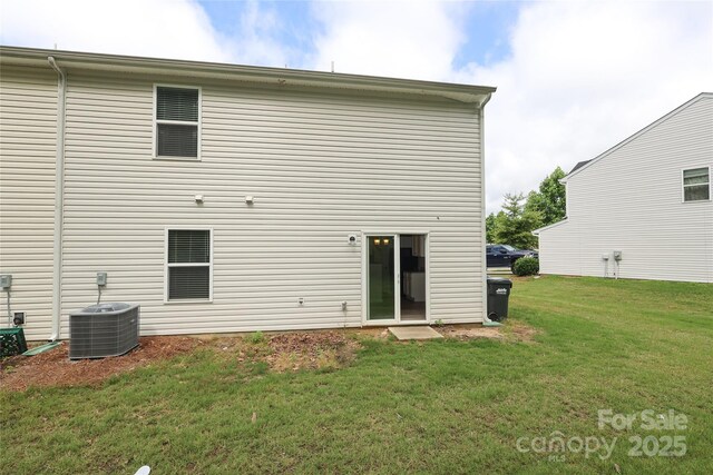 3349 Ellingford Rd, Charlotte, NC 28214 - back of house with central AC and a lawn