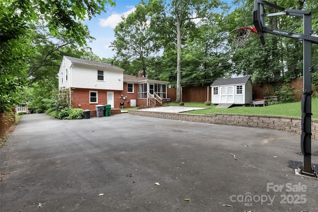 3624 Moultrie St, Charlotte, NC 28209 - rear view of property featuring brick siding, entry steps, and a patio area