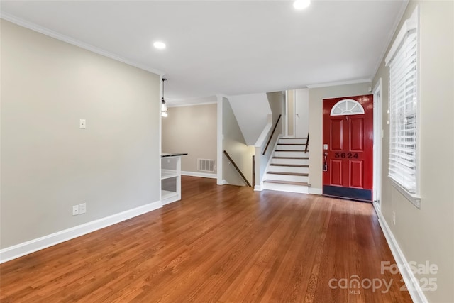 3624 Moultrie St, Charlotte, NC 28209 - foyer with crown molding, wood finished floors, baseboards, recessed lighting, and stairway