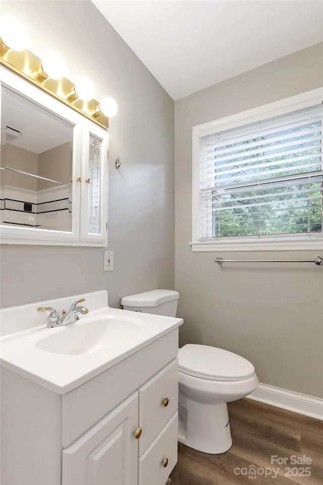 3624 Moultrie St, Charlotte, NC 28209 - full bathroom featuring vanity, wood finished floors, toilet, and a shower