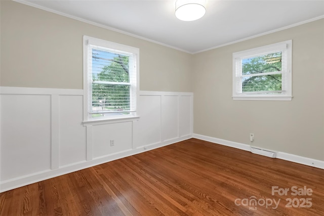 3624 Moultrie St, Charlotte, NC 28209 - unfurnished room featuring plenty of natural light, wood finished floors, ornamental molding, a wainscoted wall, and a decorative wall