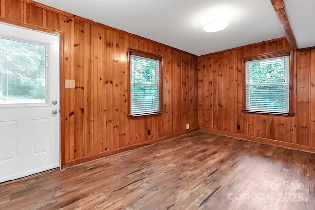 3624 Moultrie St, Charlotte, NC 28209 - entrance foyer featuring wood walls, wood finished floors, and baseboards
