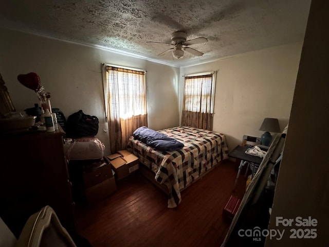 537 Beall St NW, Lenoir, NC 28645 - bedroom featuring wood finished floors, a textured ceiling, and a ceiling fan