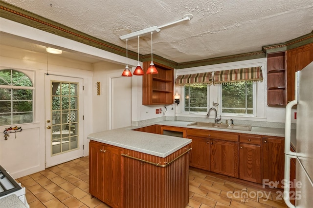 20 Kenilwood Pl, Asheville, NC 28803 - kitchen featuring open shelves, freestanding refrigerator, light countertops, plenty of natural light, and a textured ceiling