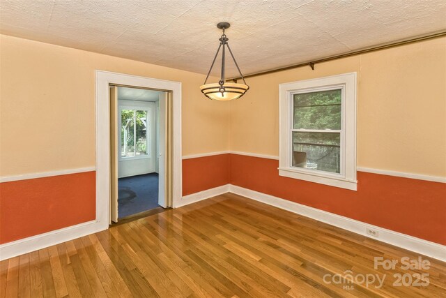 20 Kenilwood Pl, Asheville, NC 28803 - spare room featuring wood finished floors, baseboards, and a textured ceiling