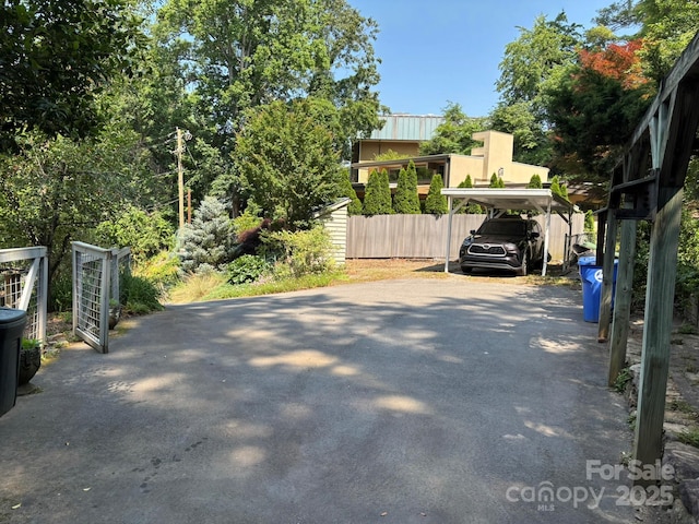20 Kenilwood Pl, Asheville, NC 28803 - view of parking / parking lot featuring driveway and a carport