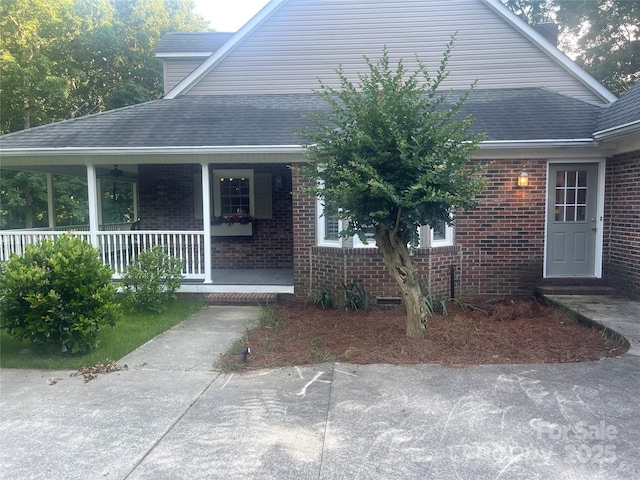 1619 Bellamy Cir, Albemarle, NC 28001 - entrance to property featuring brick siding, roof with shingles, and covered porch