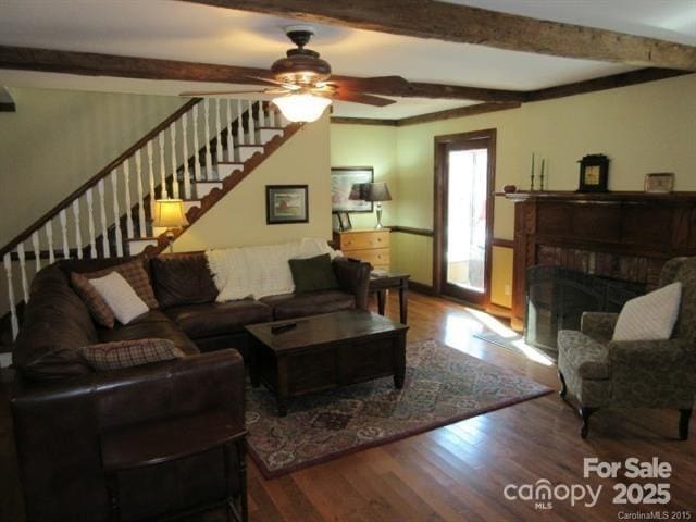 1619 Bellamy Cir, Albemarle, NC 28001 - living area with wood finished floors, beamed ceiling, stairway, ceiling fan, and a fireplace