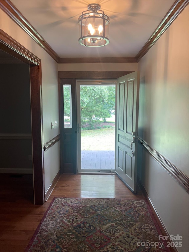 1619 Bellamy Cir, Albemarle, NC 28001 - doorway featuring wood finished floors, ornamental molding, and baseboards