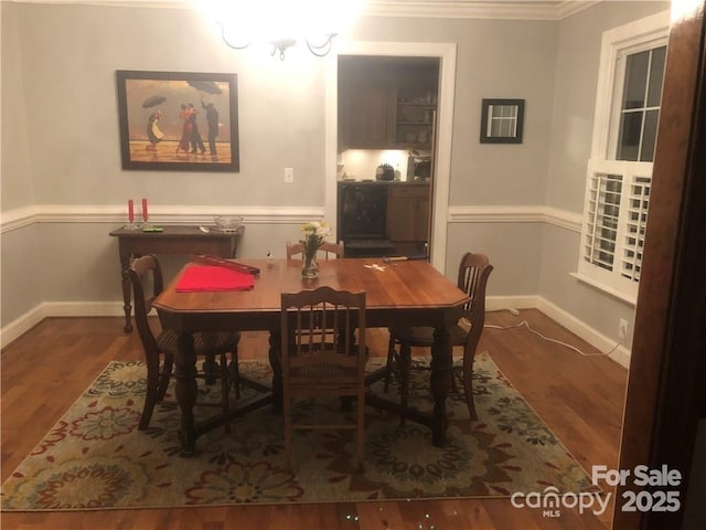 1619 Bellamy Cir, Albemarle, NC 28001 - dining space featuring crown molding, wood finished floors, and baseboards