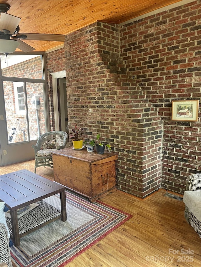 1619 Bellamy Cir, Albemarle, NC 28001 - living room with brick wall, wood ceiling, a ceiling fan, and wood finished floors