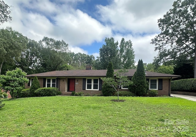 1115 Dumbarton Rd, Gastonia, NC 28054 - single story home featuring brick siding, a front yard, and a chimney