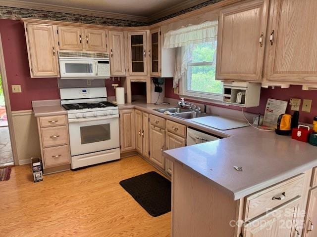 6561 Weldon Cir NW, Concord, NC 28027 - kitchen with white appliances, ornamental molding, light wood-type flooring, light countertops, and a sink