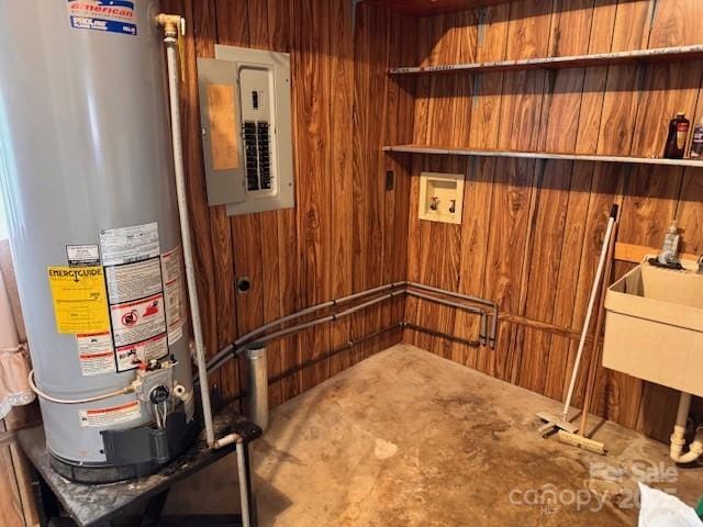 6561 Weldon Cir NW, Concord, NC 28027 - bathroom featuring gas water heater, electric panel, and wooden walls