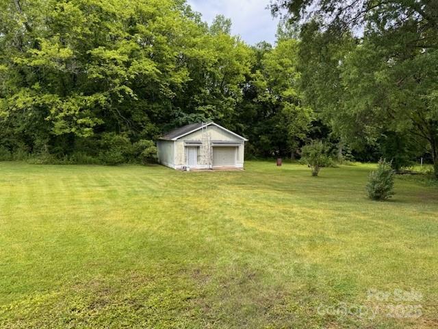 6561 Weldon Cir NW, Concord, NC 28027 - view of green lawn featuring an outbuilding