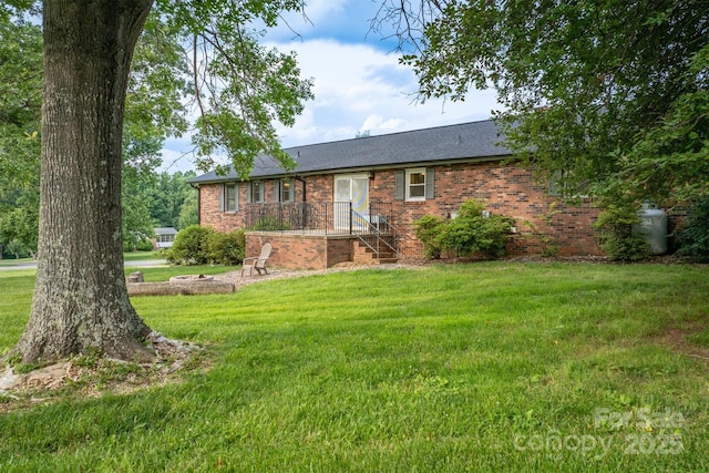 2653 Fairway Acres Cir, Lenoir, NC 28645 - ranch-style house featuring brick siding, a front lawn, and a shingled roof