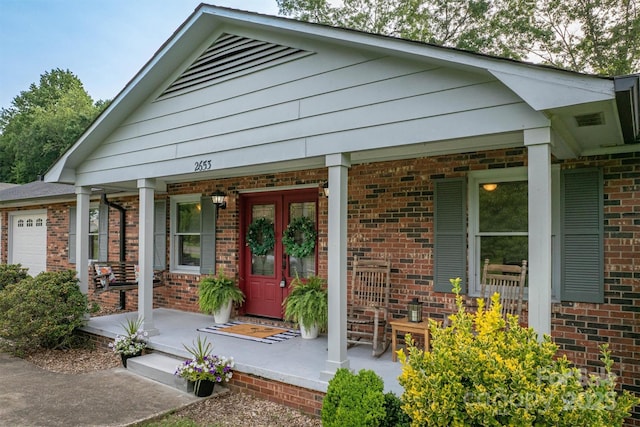 2653 Fairway Acres Cir, Lenoir, NC 28645 - view of front of home featuring covered porch, brick siding, and an attached garage
