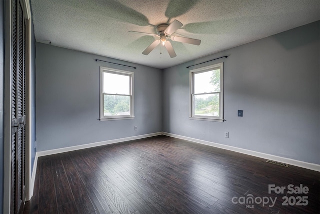 2653 Fairway Acres Cir, Lenoir, NC 28645 - unfurnished room featuring a ceiling fan, dark wood-type flooring, and a textured ceiling