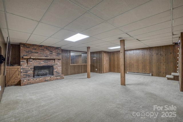 2653 Fairway Acres Cir, Lenoir, NC 28645 - finished basement with carpet flooring, baseboard heating, wood walls, a fireplace, and a paneled ceiling
