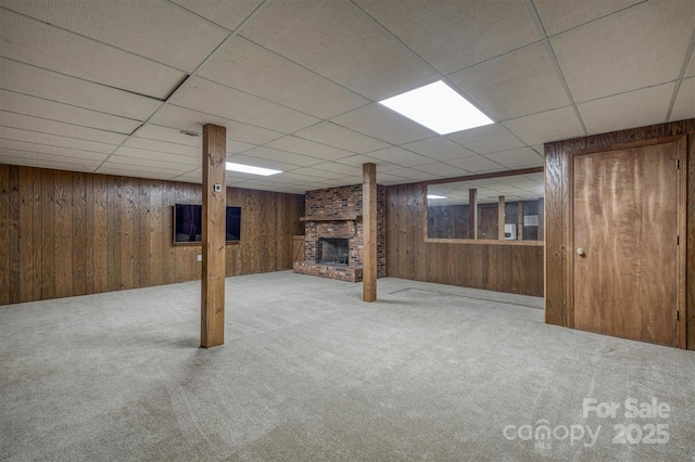 2653 Fairway Acres Cir, Lenoir, NC 28645 - finished basement featuring carpet floors, a fireplace, wooden walls, and a paneled ceiling