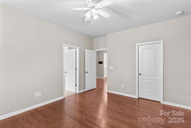 18339 The Commons Blvd, Cornelius, NC 28031 - unfurnished bedroom with wood finished floors, baseboards, and a ceiling fan