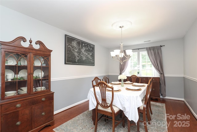 2018 Rosewater Ln, Indian Trail, NC 28079 - dining room featuring a chandelier, baseboards, and wood finished floors