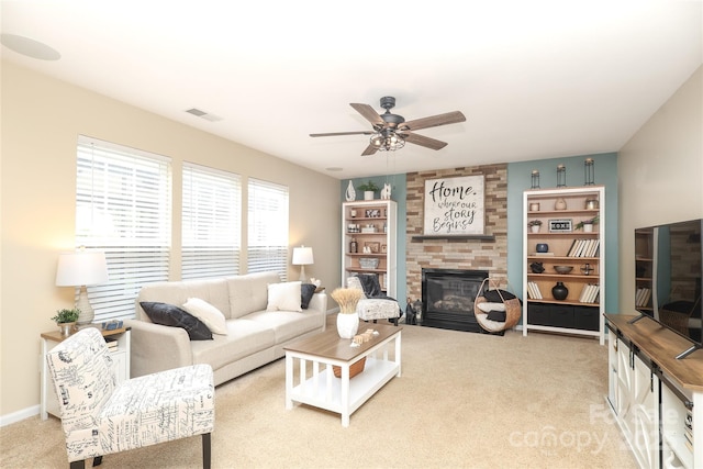 2018 Rosewater Ln, Indian Trail, NC 28079 - living room with a fireplace, carpet, and ceiling fan