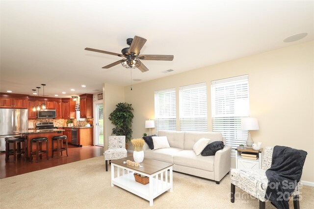 2018 Rosewater Ln, Indian Trail, NC 28079 - living area featuring light colored carpet, ceiling fan, and recessed lighting