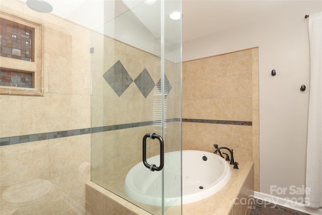 2018 Rosewater Ln, Indian Trail, NC 28079 - bathroom featuring a tile shower and a whirlpool tub