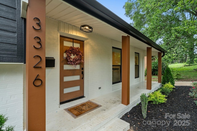 3326 Winterfield Pl, Charlotte, NC 28205 - view of exterior entry with brick siding and covered porch