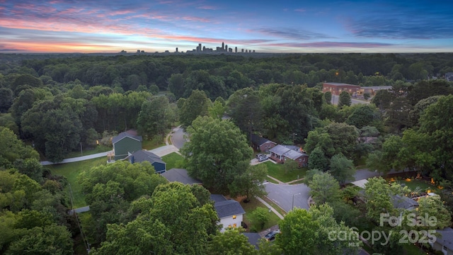 3326 Winterfield Pl, Charlotte, NC 28205 - aerial overview of property's location with a heavily wooded area
