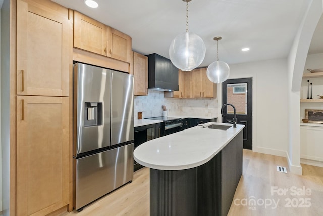 3326 Winterfield Pl, Charlotte, NC 28205 - kitchen with stainless steel refrigerator with ice dispenser, wall chimney exhaust hood, light wood finished floors, light countertops, and recessed lighting