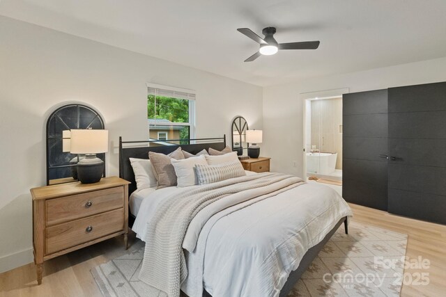 3326 Winterfield Pl, Charlotte, NC 28205 - bedroom featuring light wood-style floors, ensuite bathroom, and a ceiling fan